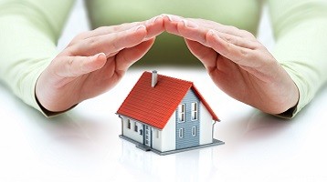 Hands over a home, symbolizing home insurance with Coast 2 Coast Insurance